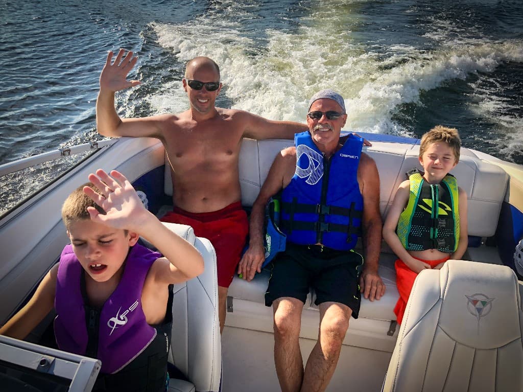 Four generations on the boat — one kid making it clear this ride is by invitation only